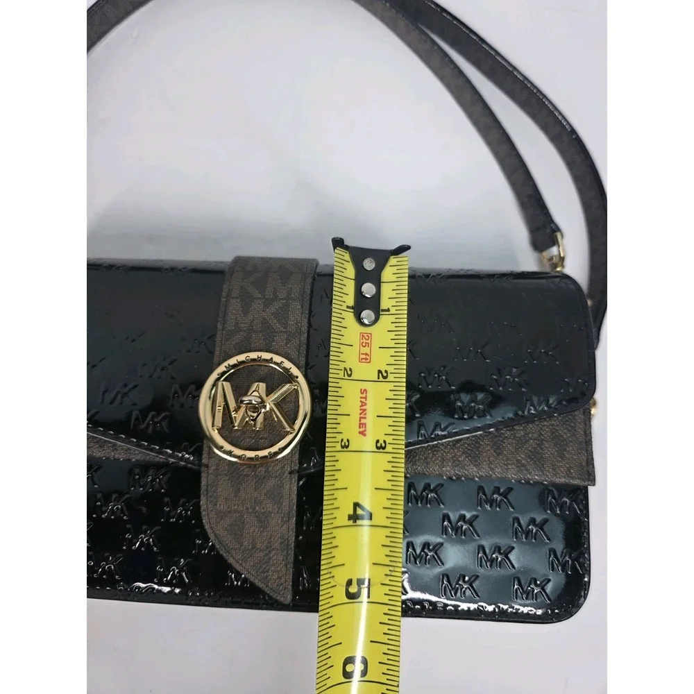 Michael Kors Greenwich medium logo-embossed patent leather shoulder bag in black